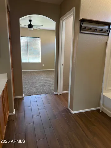 an entryway with wooden floor
