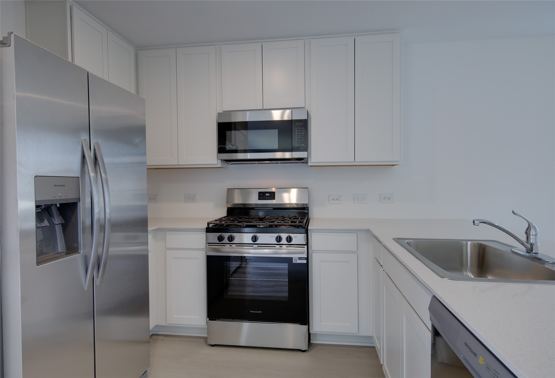 10915 Tawny Rdg Drive Beasley, TX 77417 - Photo 12 of 33 a kitchen with a stove and a refrigerator