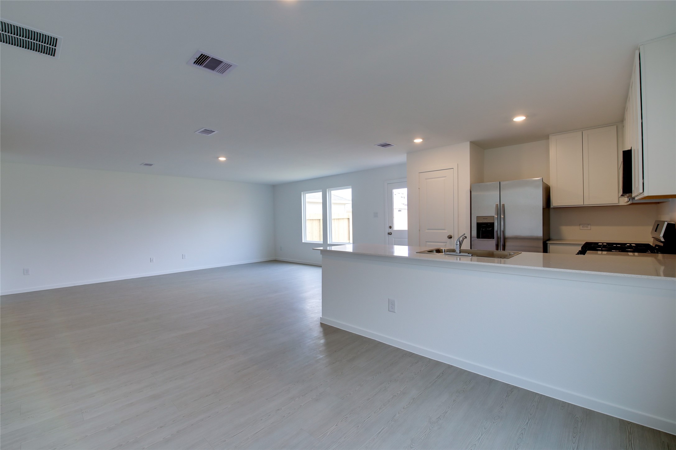 10915 Tawny Rdg Drive Beasley, TX 77417 - Photo 14 of 33 a view of a kitchen with a sink and cabinets