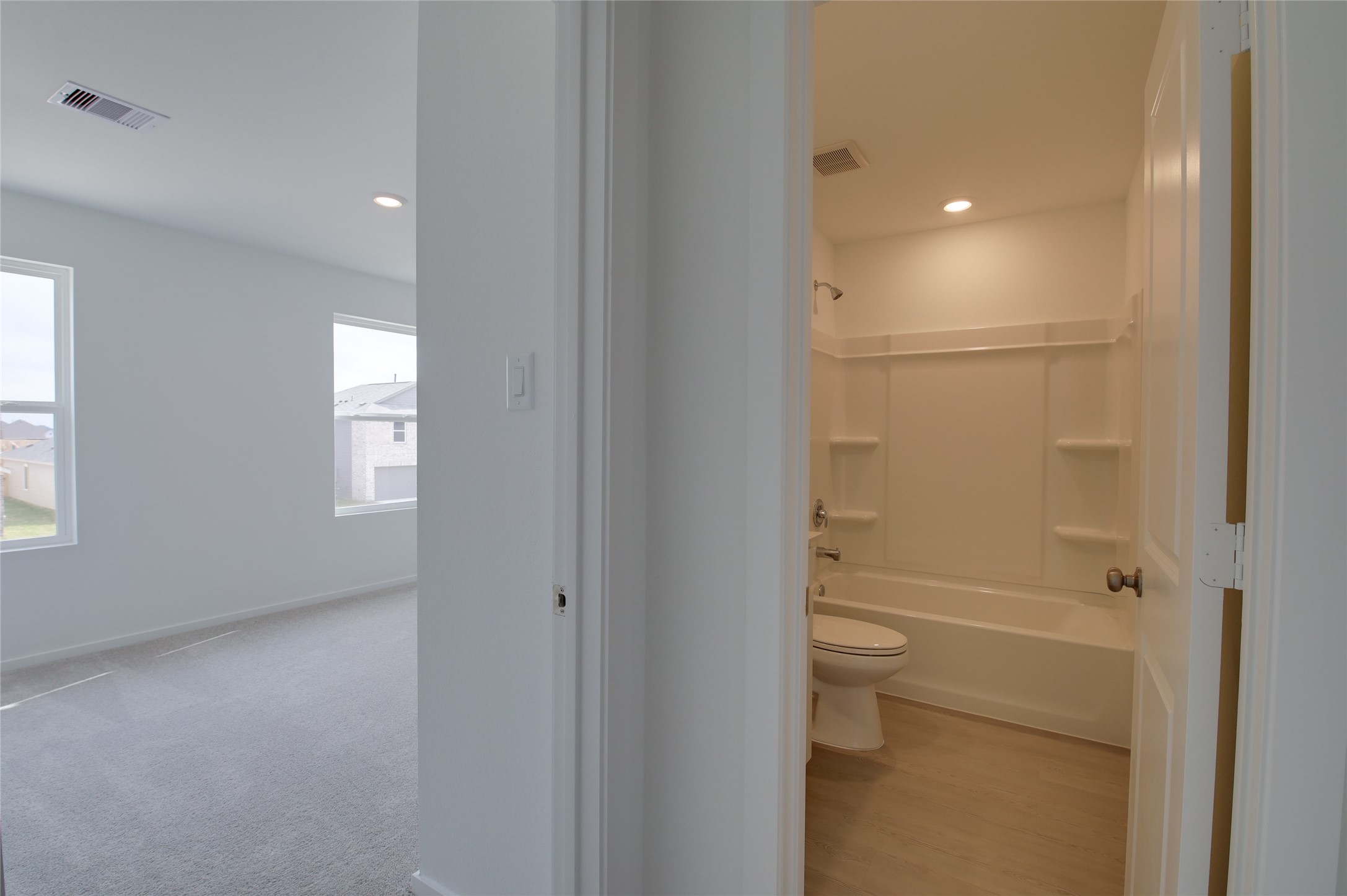 10915 Tawny Rdg Drive Beasley, TX 77417 - Photo 26 of 33 a bathroom with a glass shower door