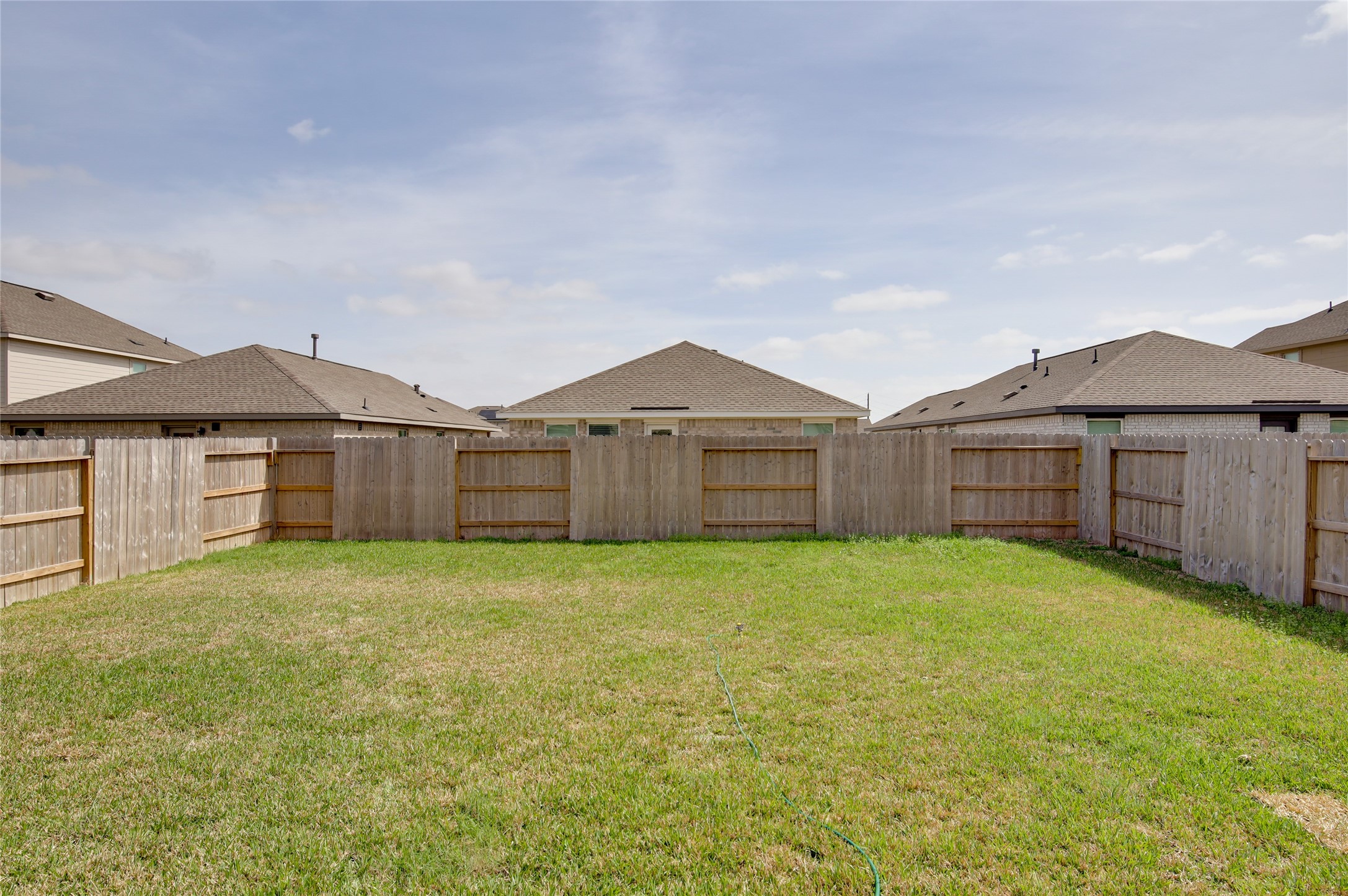 10915 Tawny Rdg Drive Beasley, TX 77417 - Photo 33 of 33 a view of a yard in front of a house with wooden fence