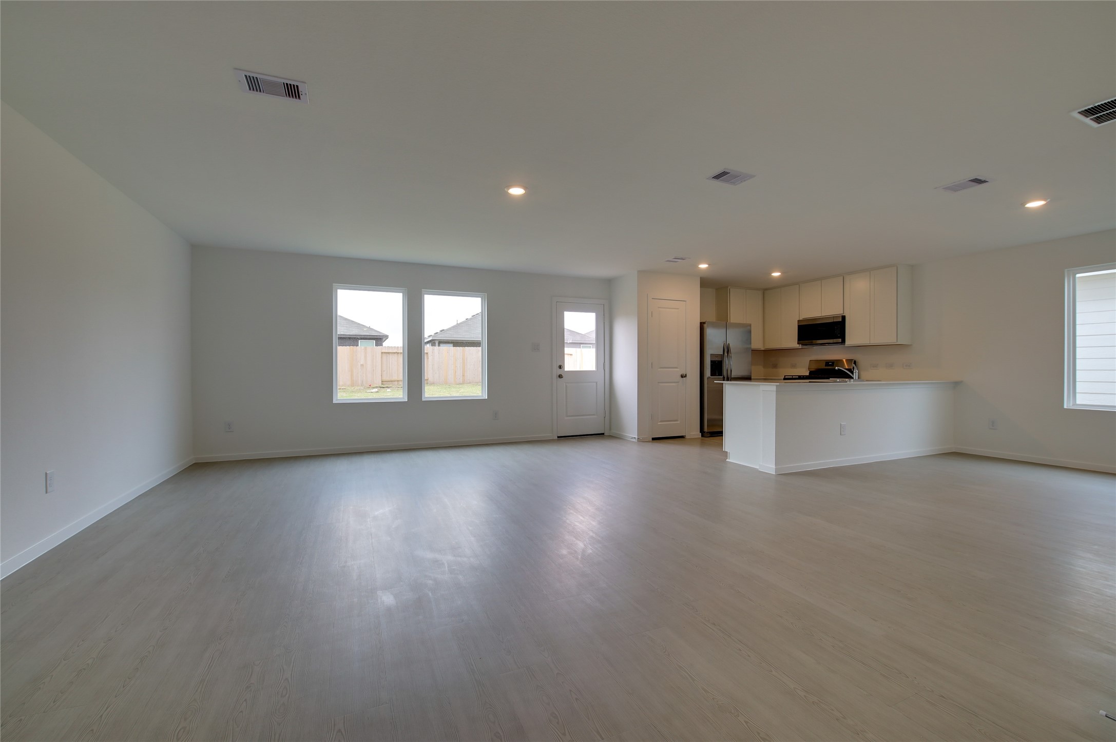 10915 Tawny Rdg Drive Beasley, TX 77417 - Photo 7 of 33 a view of a kitchen with a sink and a stove top oven