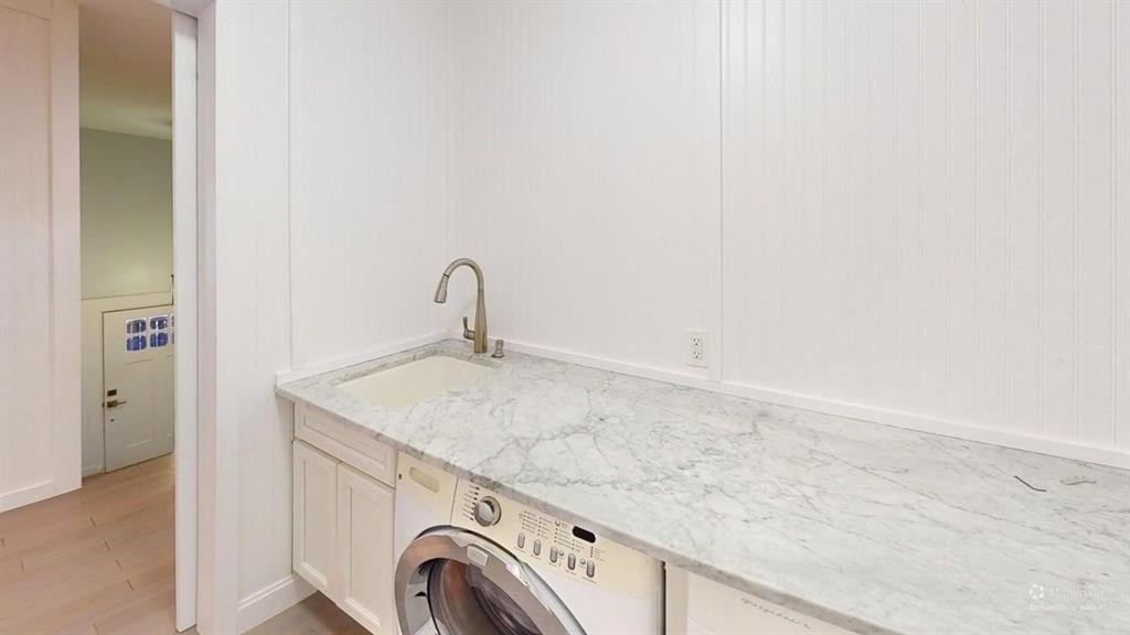 5805 Ranger Drive Rockwall, TX 75032 - Photo 17 of 24 a utility room with a sink dryer and washer