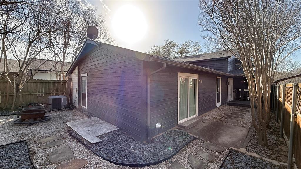 5805 Ranger Drive Rockwall, TX 75032 - Photo 19 of 24 a view of a house with a cars back yard