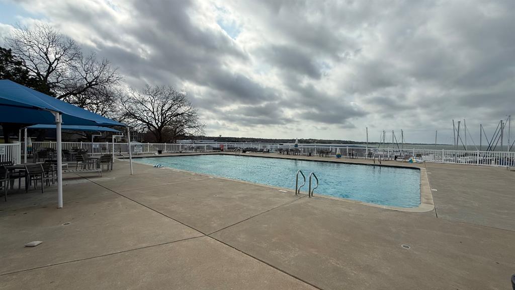 5805 Ranger Drive Rockwall, TX 75032 - Photo 20 of 24 a view of a swimming pool and a yard