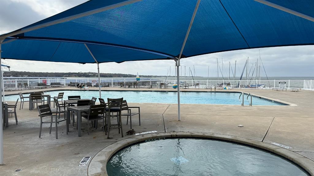 5805 Ranger Drive Rockwall, TX 75032 - Photo 21 of 24 an outdoor space with furniture and umbrella
