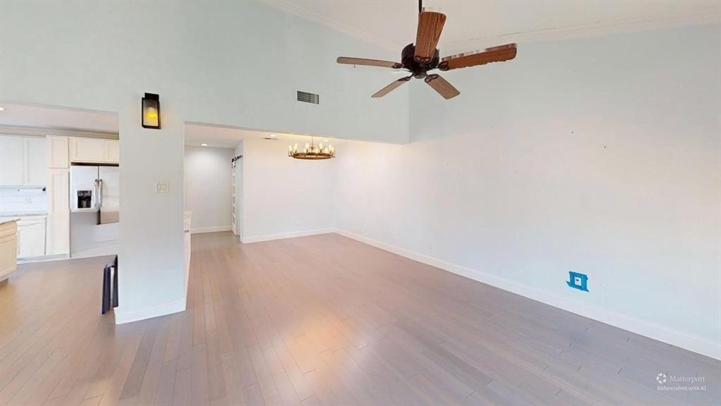 5805 Ranger Drive Rockwall, TX 75032 - Photo 5 of 24 a view of a hallway with wooden floor