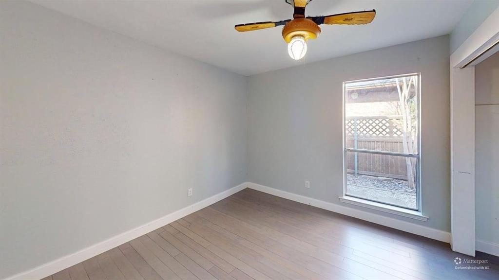 5805 Ranger Drive Rockwall, TX 75032 - Photo 10 of 24 wooden floor in an empty room with a window