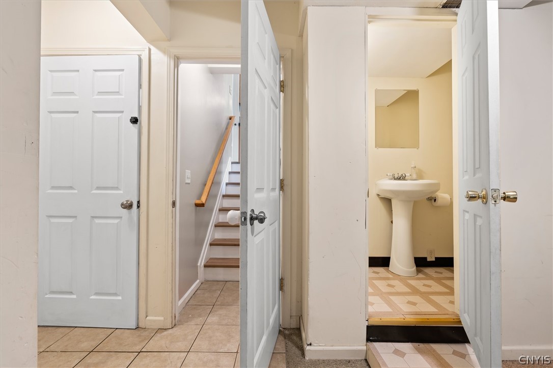 4615 Broad Road Onondaga, NY 13215 - Photo 28 of 47 Head downstairs to the half bath and family room a