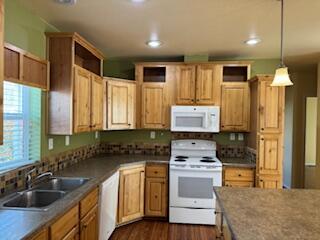 355 Colver Road, Unit 24 Talent, OR 97540 - Photo 8 of 21 a kitchen with stainless steel appliances a stove sink and cabinets