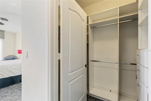 a living room with furniture a table and large windows