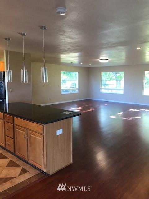 91 Hideaway Road Yakima, WA 98908 - Photo 12 of 25 a kitchen with stainless steel appliances granite countertop a granite counter tops and a wooden floors