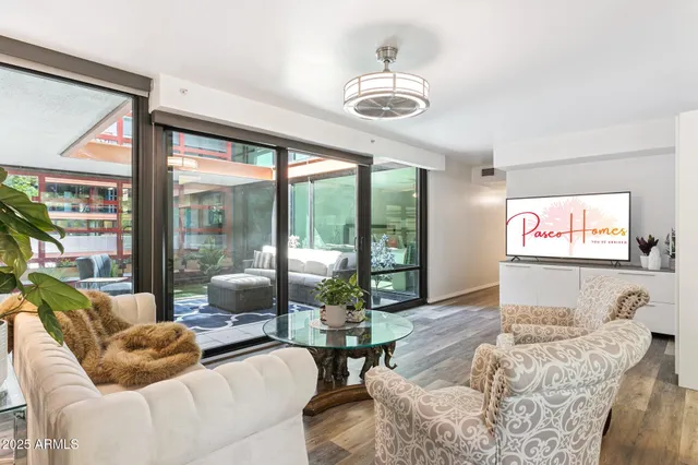 a living room with furniture and a flat screen tv