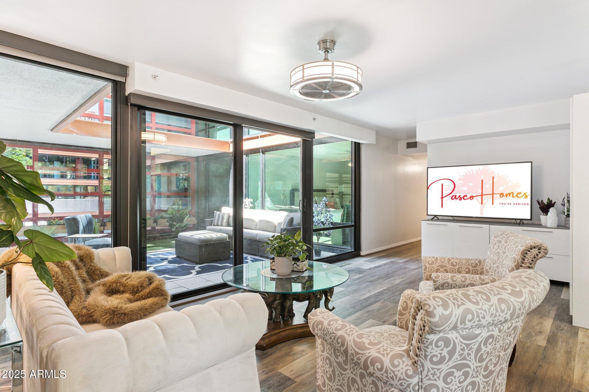 a living room with furniture and a flat screen tv