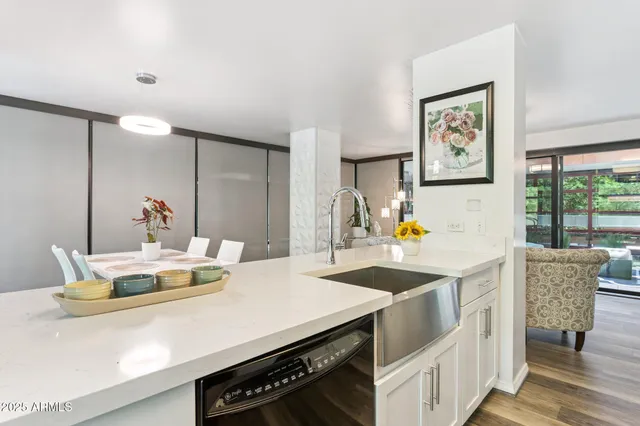 a kitchen with a stove a table and chairs