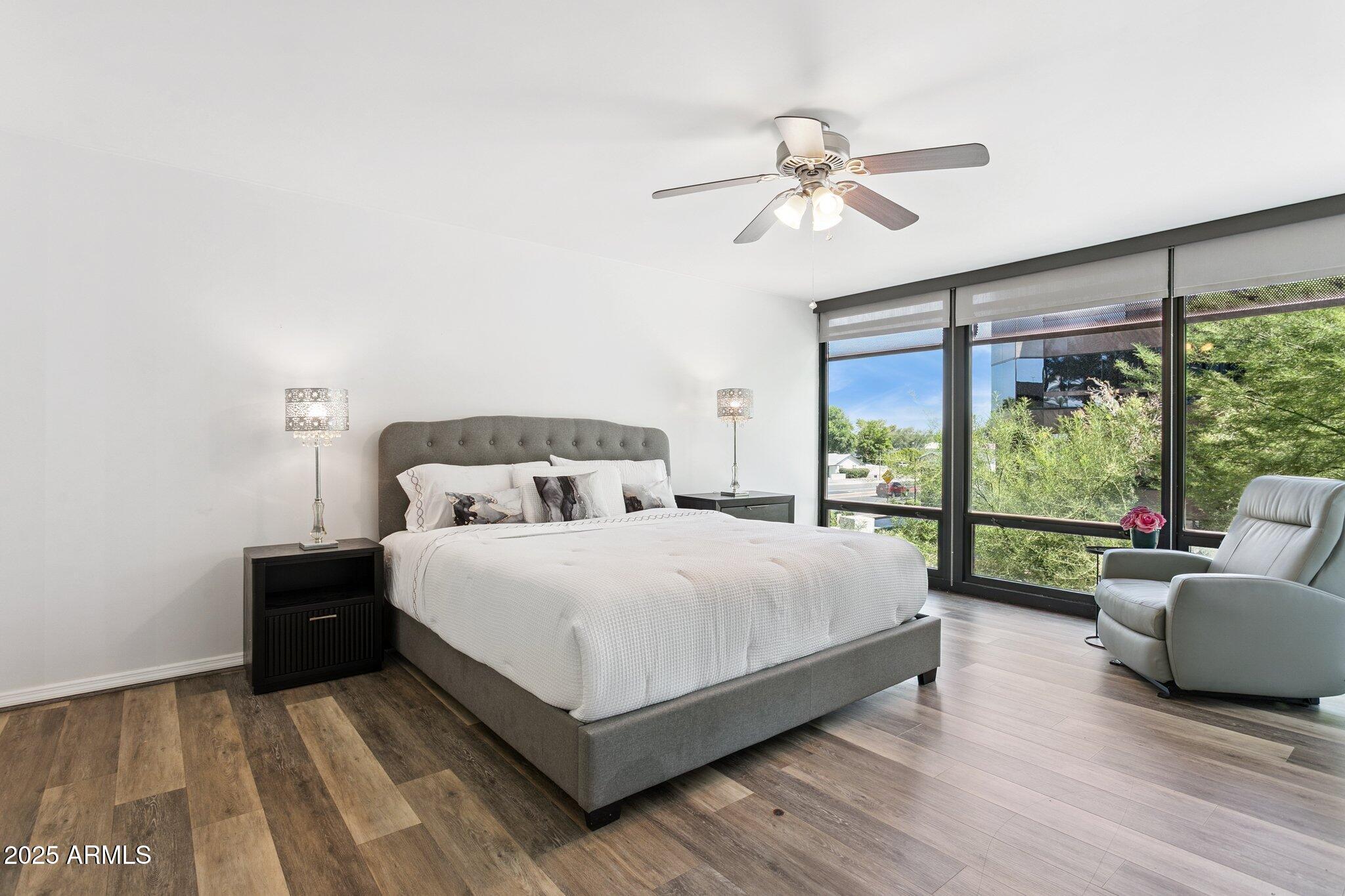 4808 North 24th Street, Unit 208 Phoenix, AZ 85016 - Photo 14 of 31 a bedroom with a bed and a large window