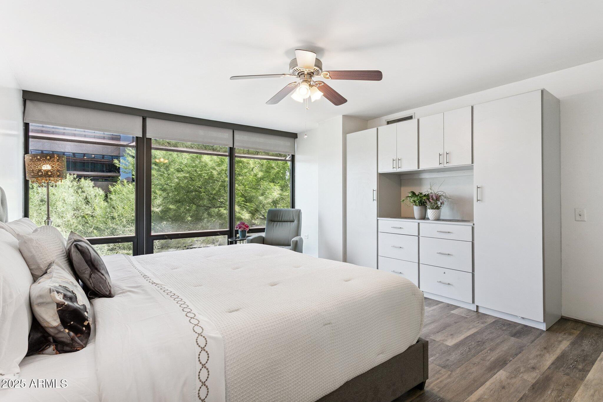 4808 North 24th Street, Unit 208 Phoenix, AZ 85016 - Photo 15 of 31 a bedroom with a bed and a large window