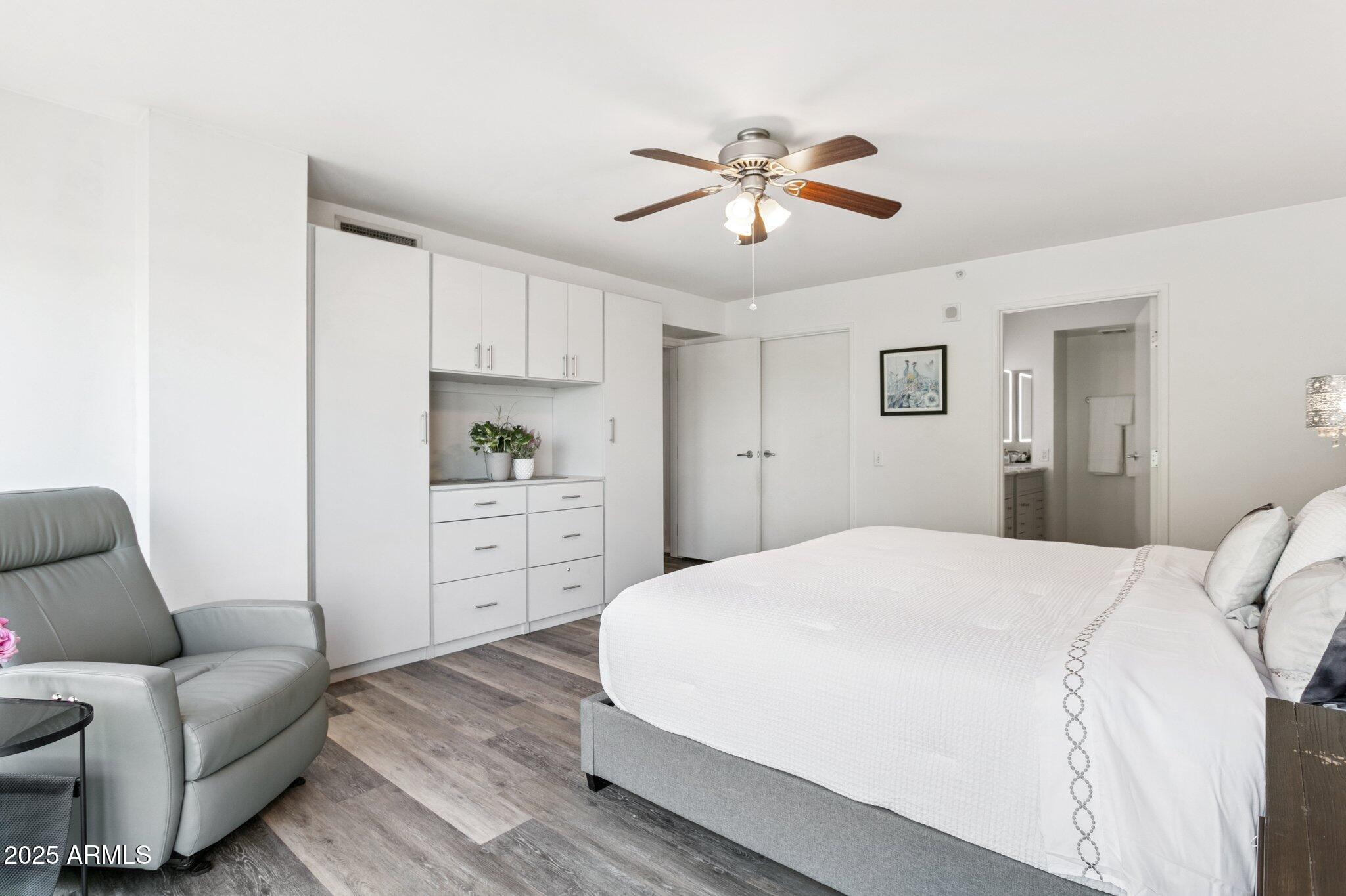 4808 North 24th Street, Unit 208 Phoenix, AZ 85016 - Photo 16 of 31 a spacious bedroom with a bed a couch and dresser
