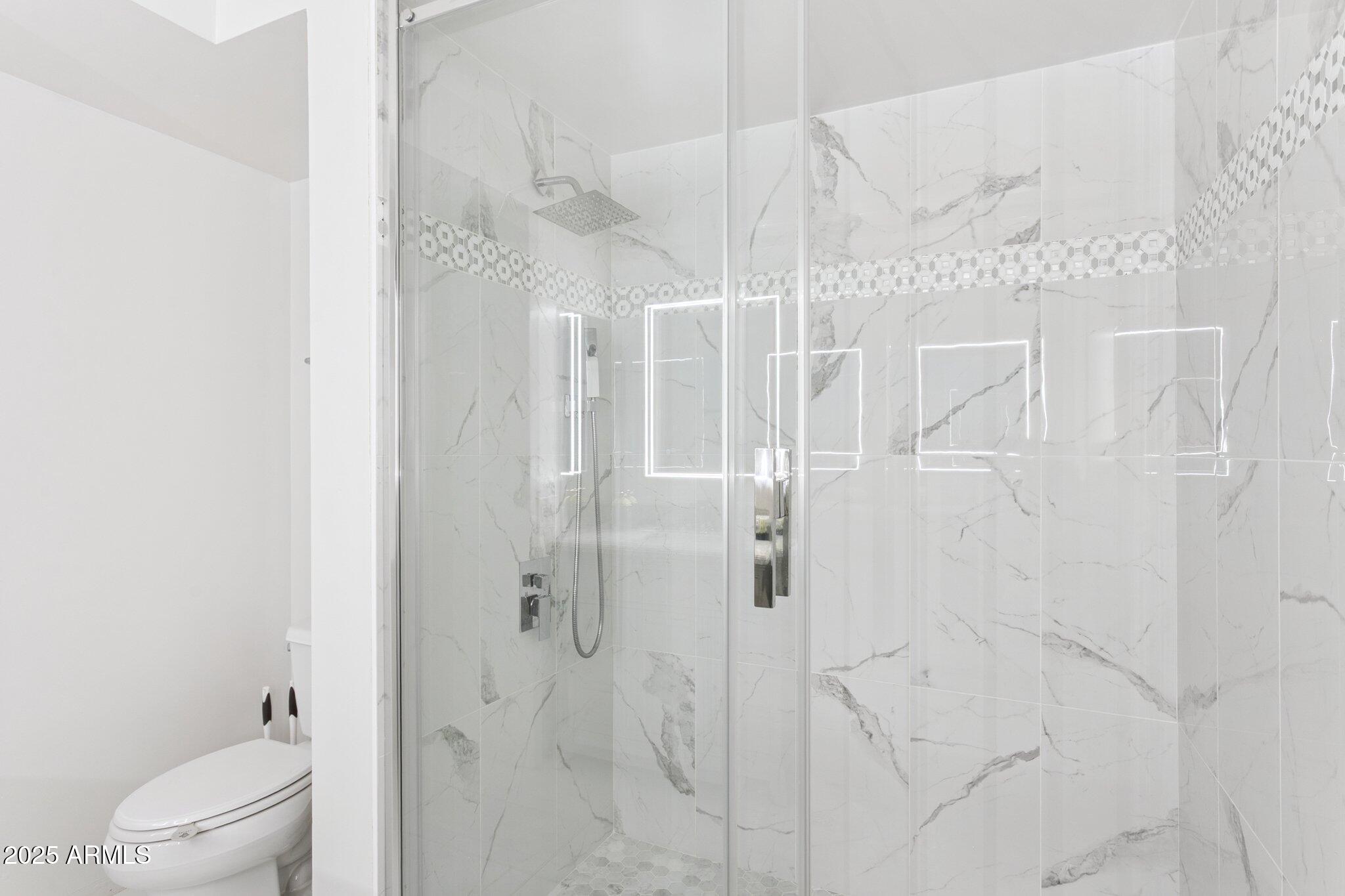 4808 North 24th Street, Unit 208 Phoenix, AZ 85016 - Photo 18 of 31 a bathroom with a shower and toilet