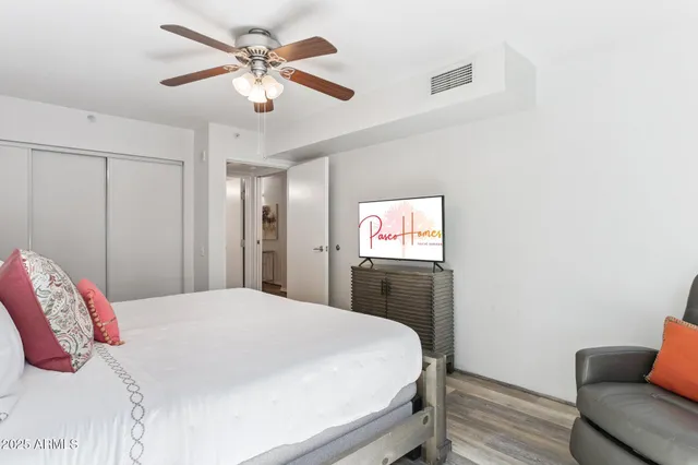 a bedroom with a bed and a couch