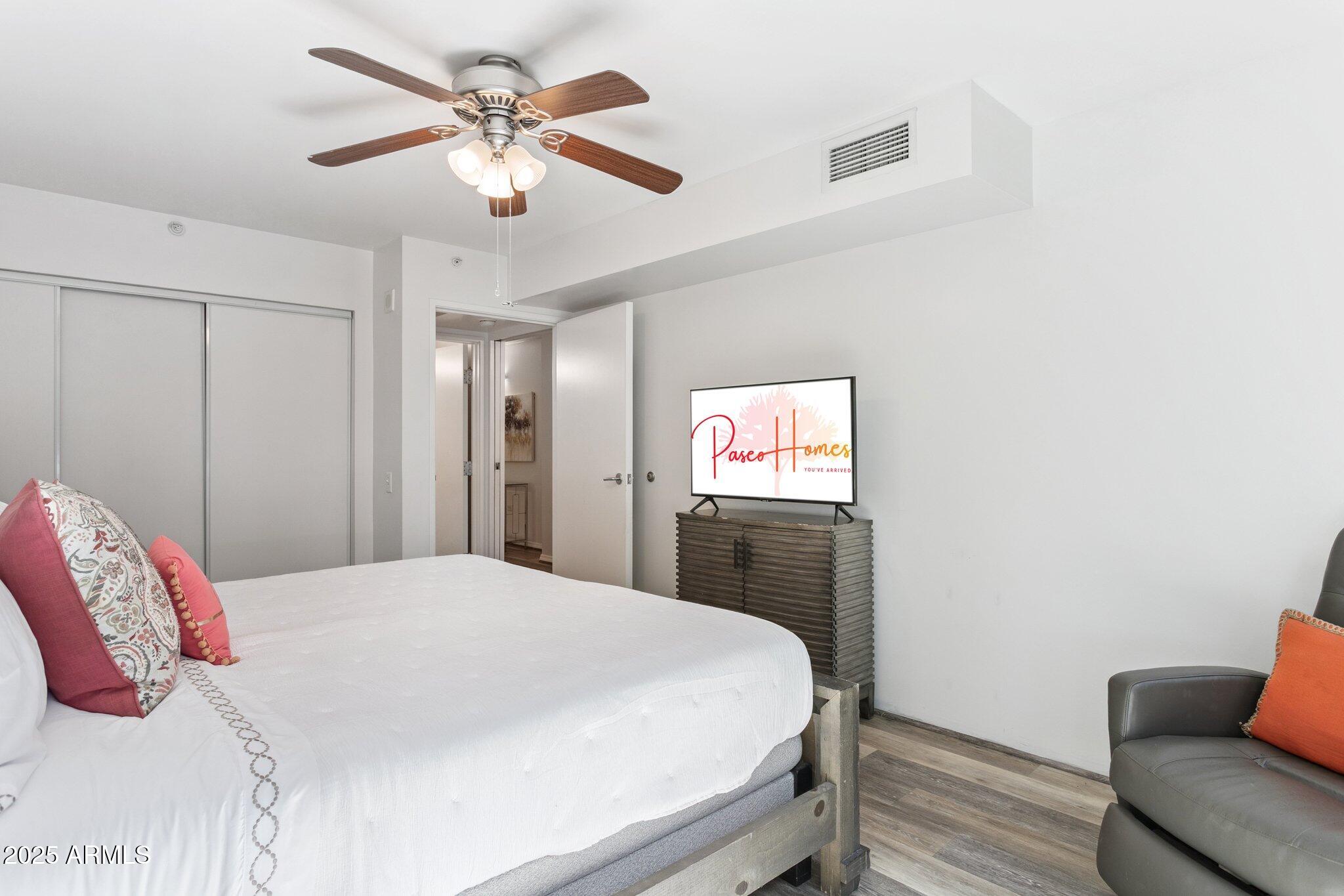 4808 North 24th Street, Unit 208 Phoenix, AZ 85016 - Photo 20 of 31 a bedroom with a bed and a couch