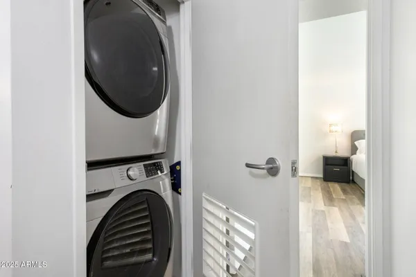 a view of a hallway with washer and dryer