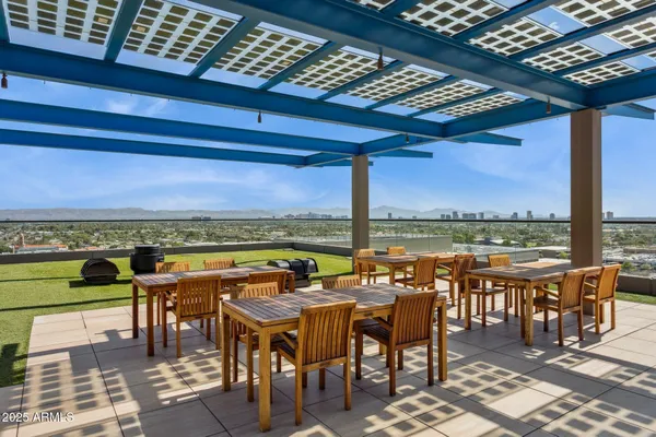 a view of a balcony with furniture