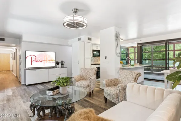 a living room with furniture and a large window