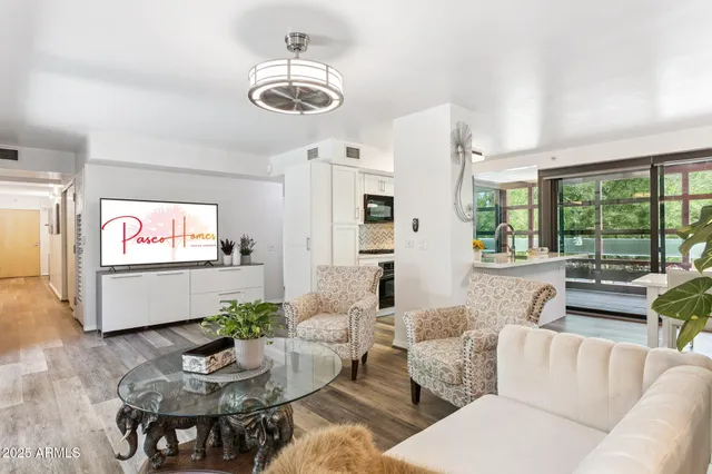 a living room with furniture and a large window
