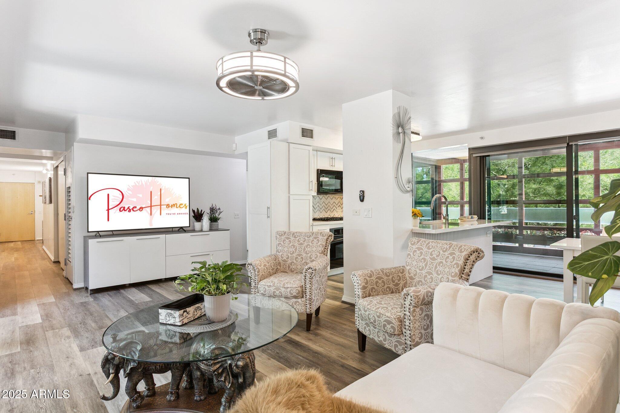 4808 North 24th Street, Unit 208 Phoenix, AZ 85016 - Photo 3 of 31 a living room with furniture and a large window