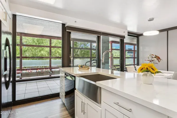 a view of a kitchen with a large window