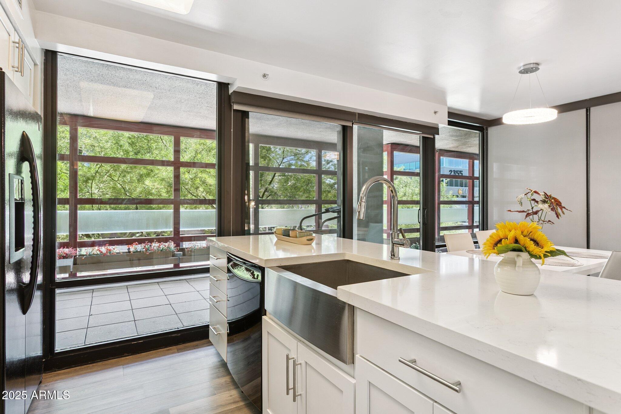 4808 North 24th Street, Unit 208 Phoenix, AZ 85016 - Photo 7 of 31 a view of a kitchen with a large window