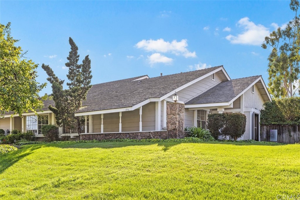 196 West Yale Loop, Unit 7 Irvine, CA 92604 - Photo 1 of 1 a front view of a house with a yard