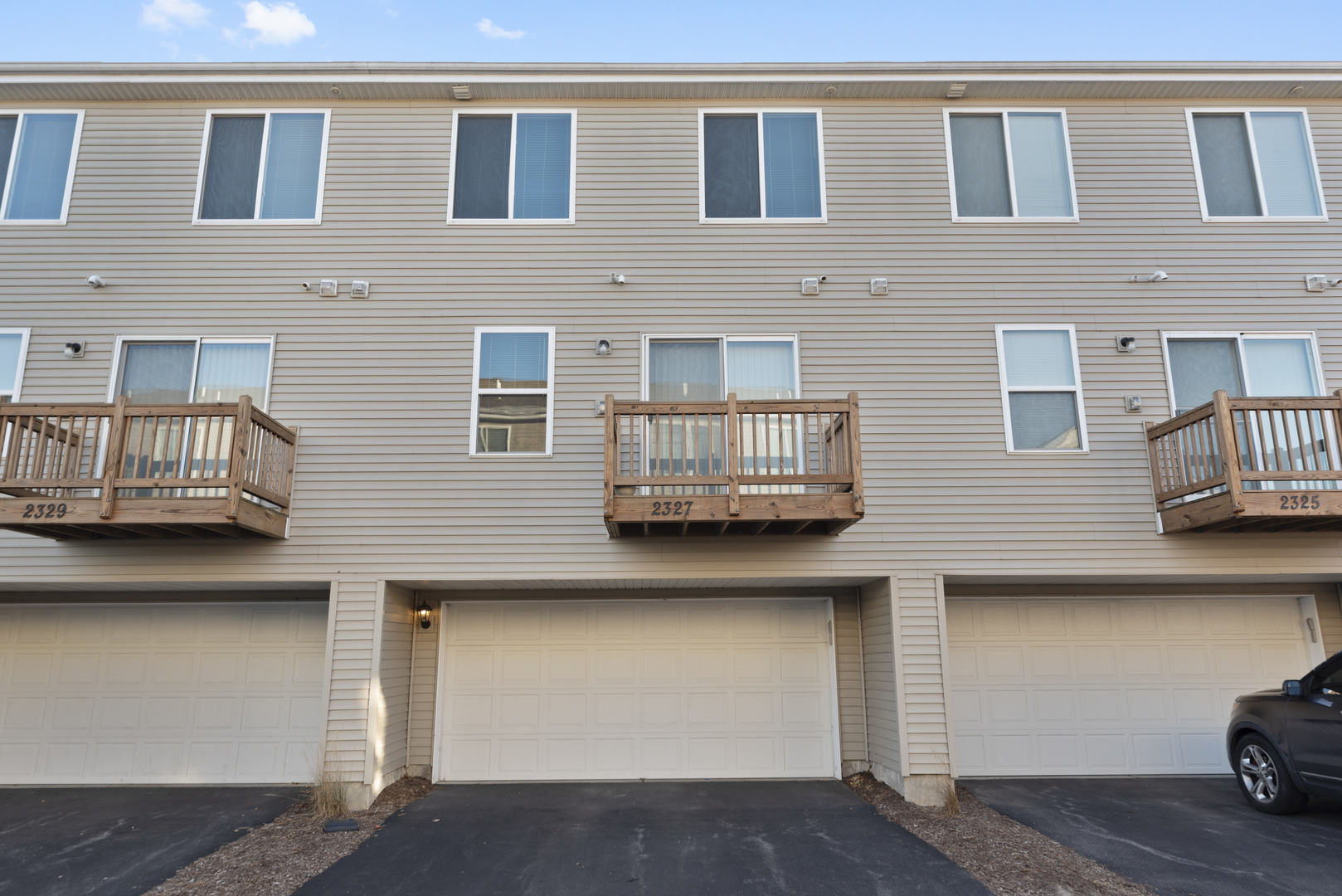2327 Upland Road Pingree Grove, IL 60140 - Photo 16 of 16 a couple of cars parked in front of a building