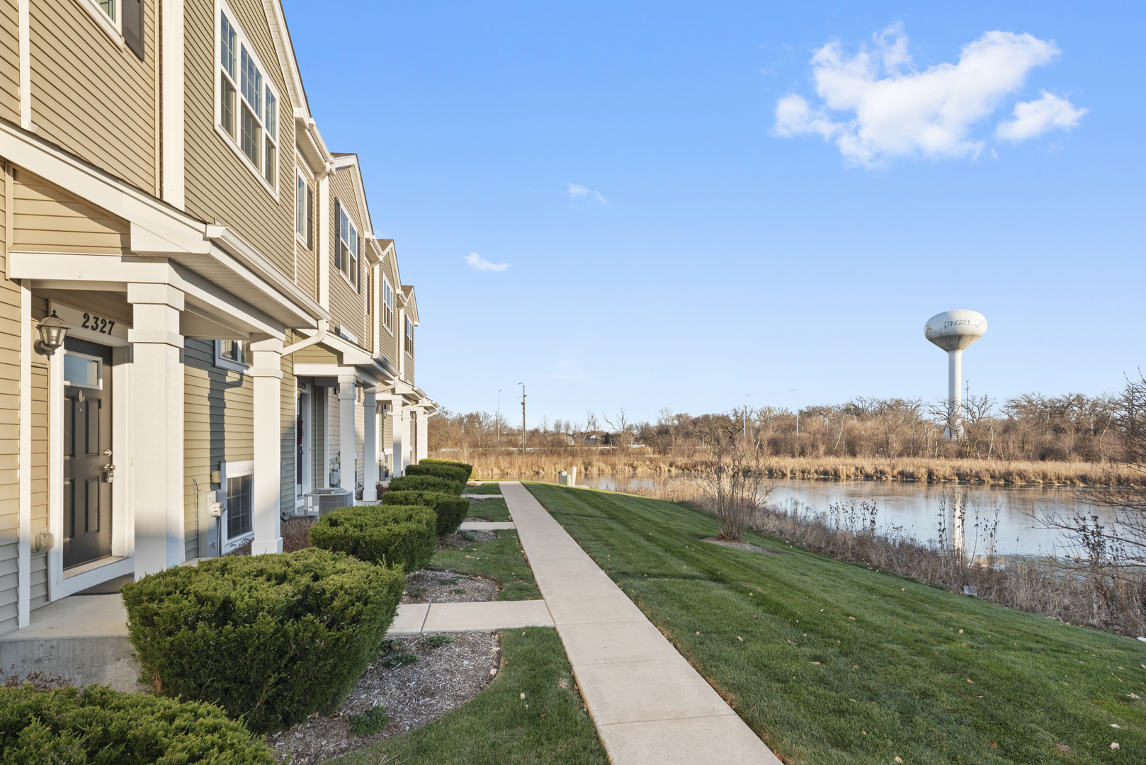 2327 Upland Road Pingree Grove, IL 60140 - Photo 2 of 16 a view of a garden with a lake