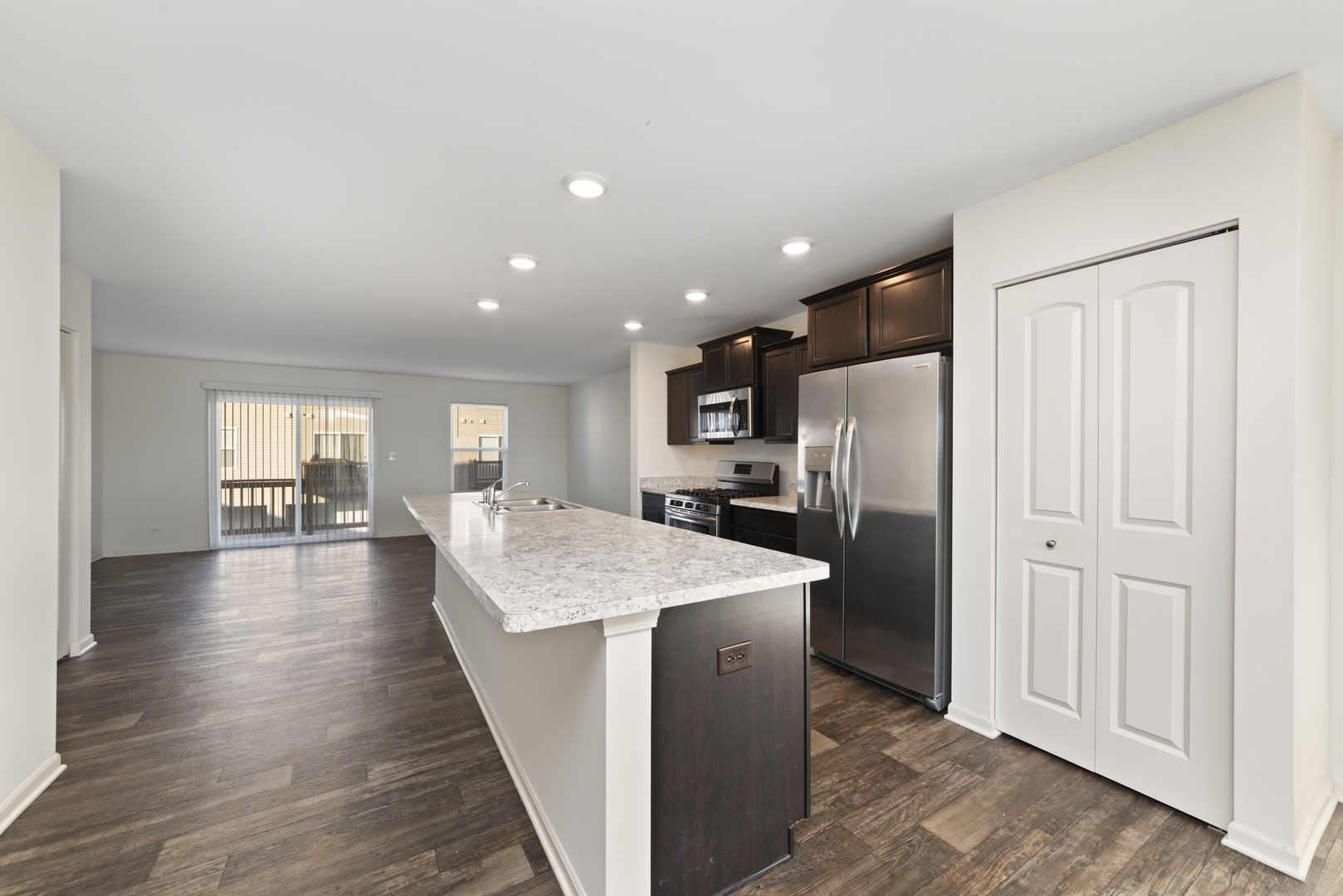 2327 Upland Road Pingree Grove, IL 60140 - Photo 3 of 16 a kitchen with stainless steel appliances granite countertop a refrigerator oven stove a sink and a refrigerator