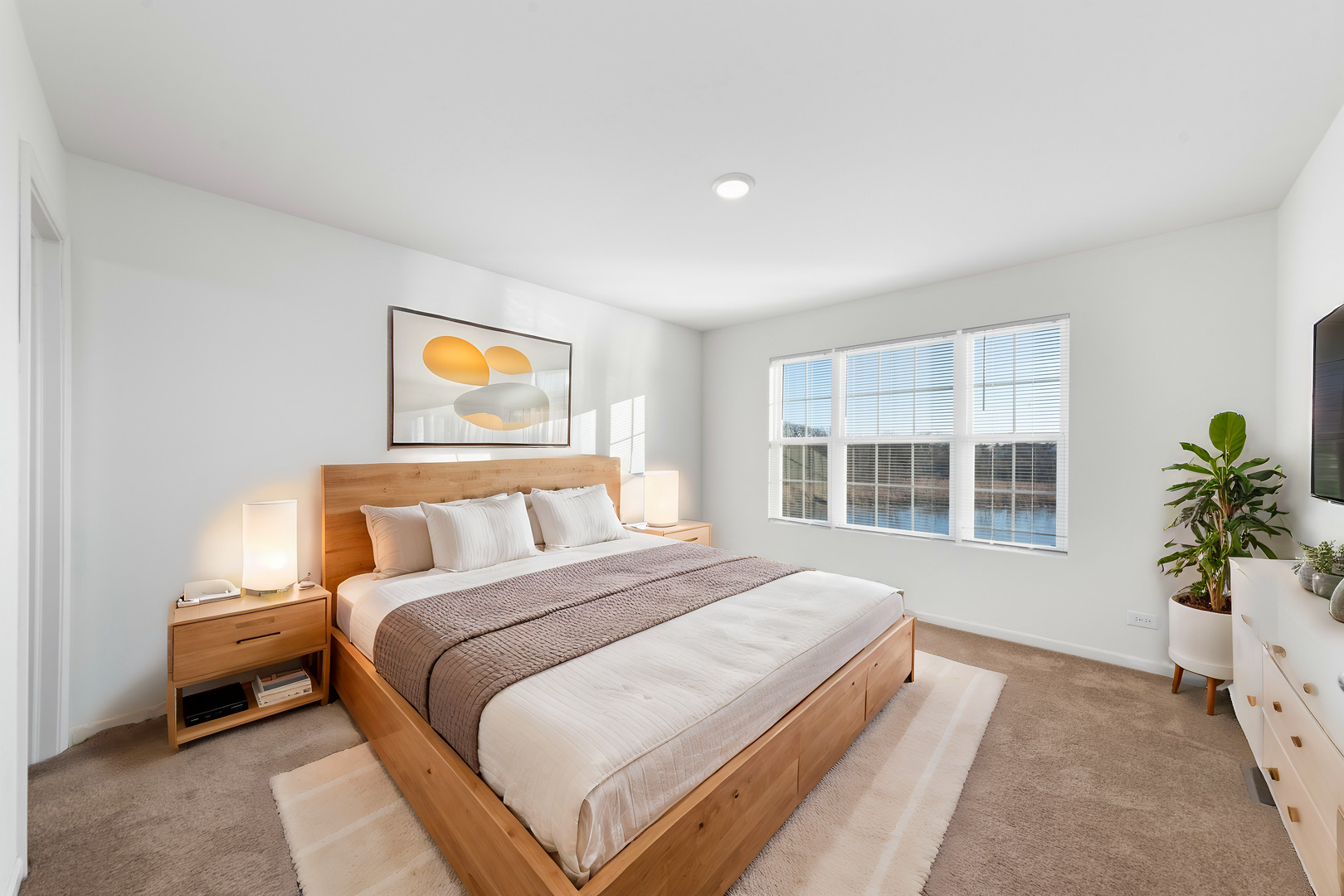 2327 Upland Road Pingree Grove, IL 60140 - Photo 8 of 16 a spacious bedroom with a large bed and a large window