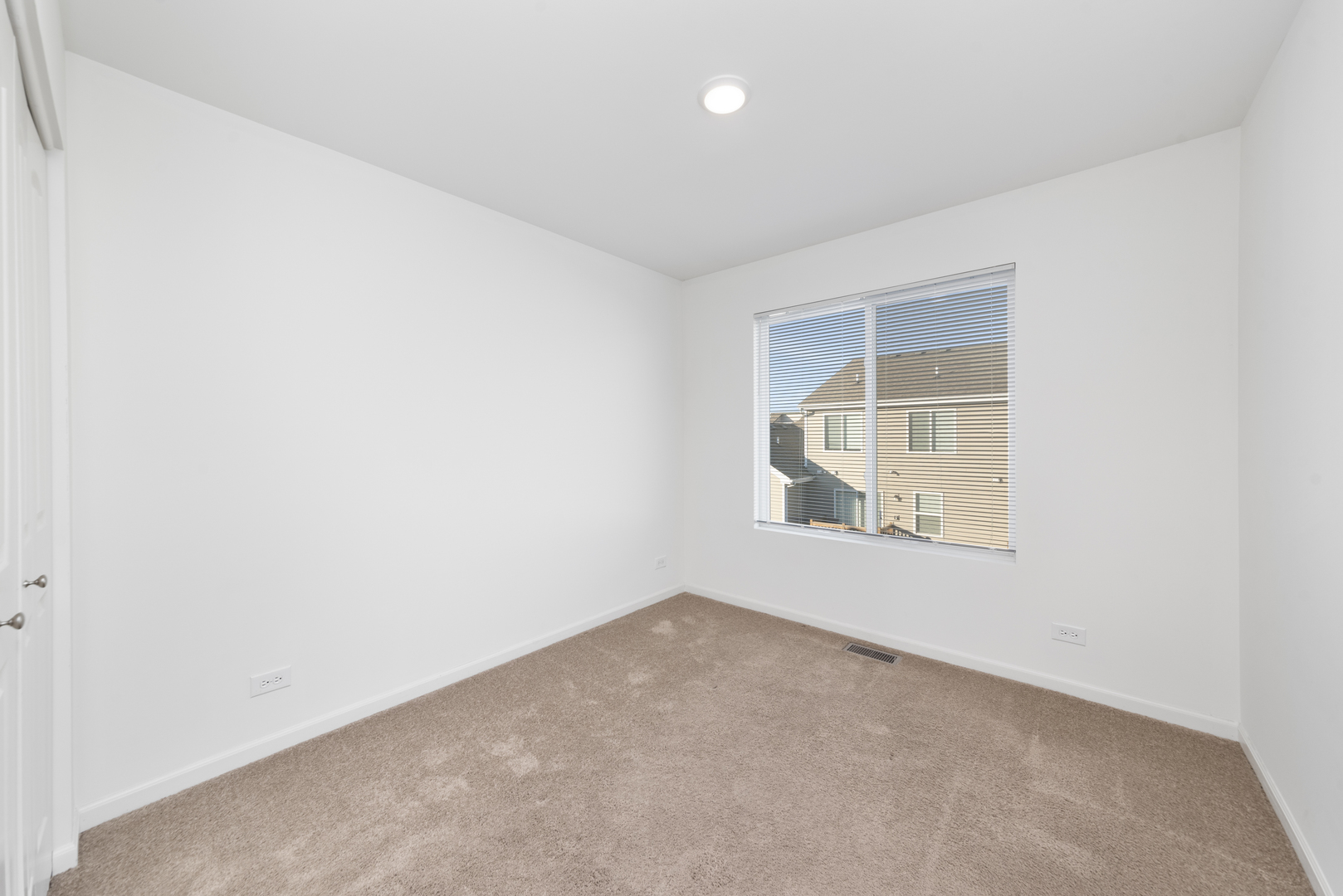 2327 Upland Road Pingree Grove, IL 60140 - Photo 10 of 16 an empty room with a window