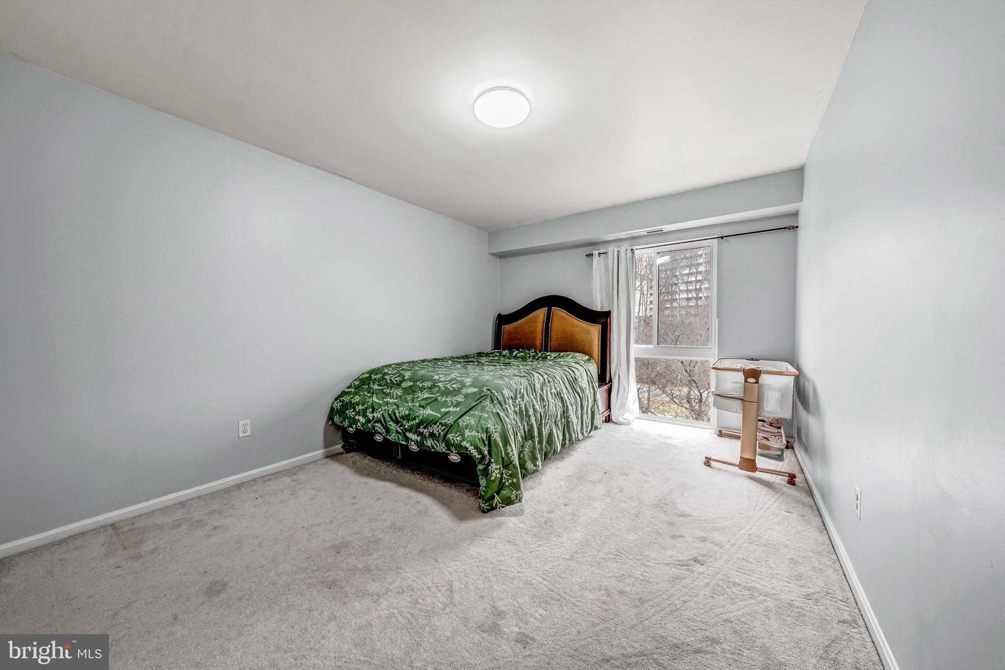 6137 Edsall Road, Unit I Alexandria, VA 22304 - Photo 16 of 28 a bedroom with a bed and a window