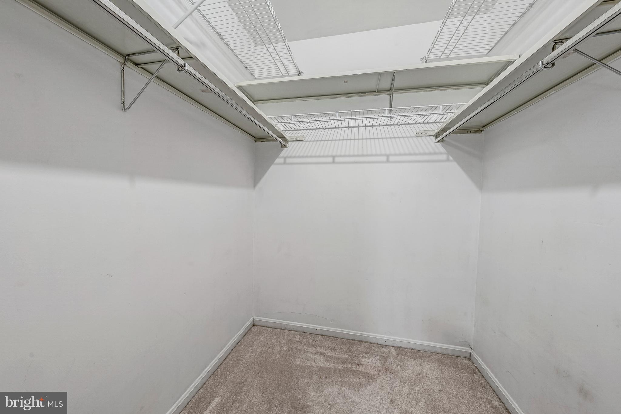 6137 Edsall Road, Unit I Alexandria, VA 22304 - Photo 19 of 28 a view of a room with racks on the wall