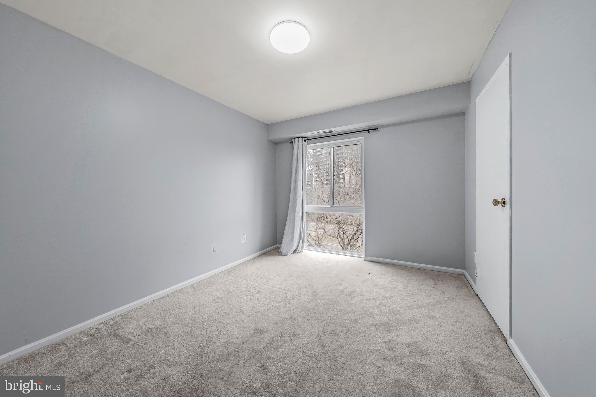 6137 Edsall Road, Unit I Alexandria, VA 22304 - Photo 21 of 28 an empty room with windows