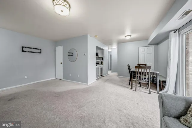 a livingroom with furniture and white walls