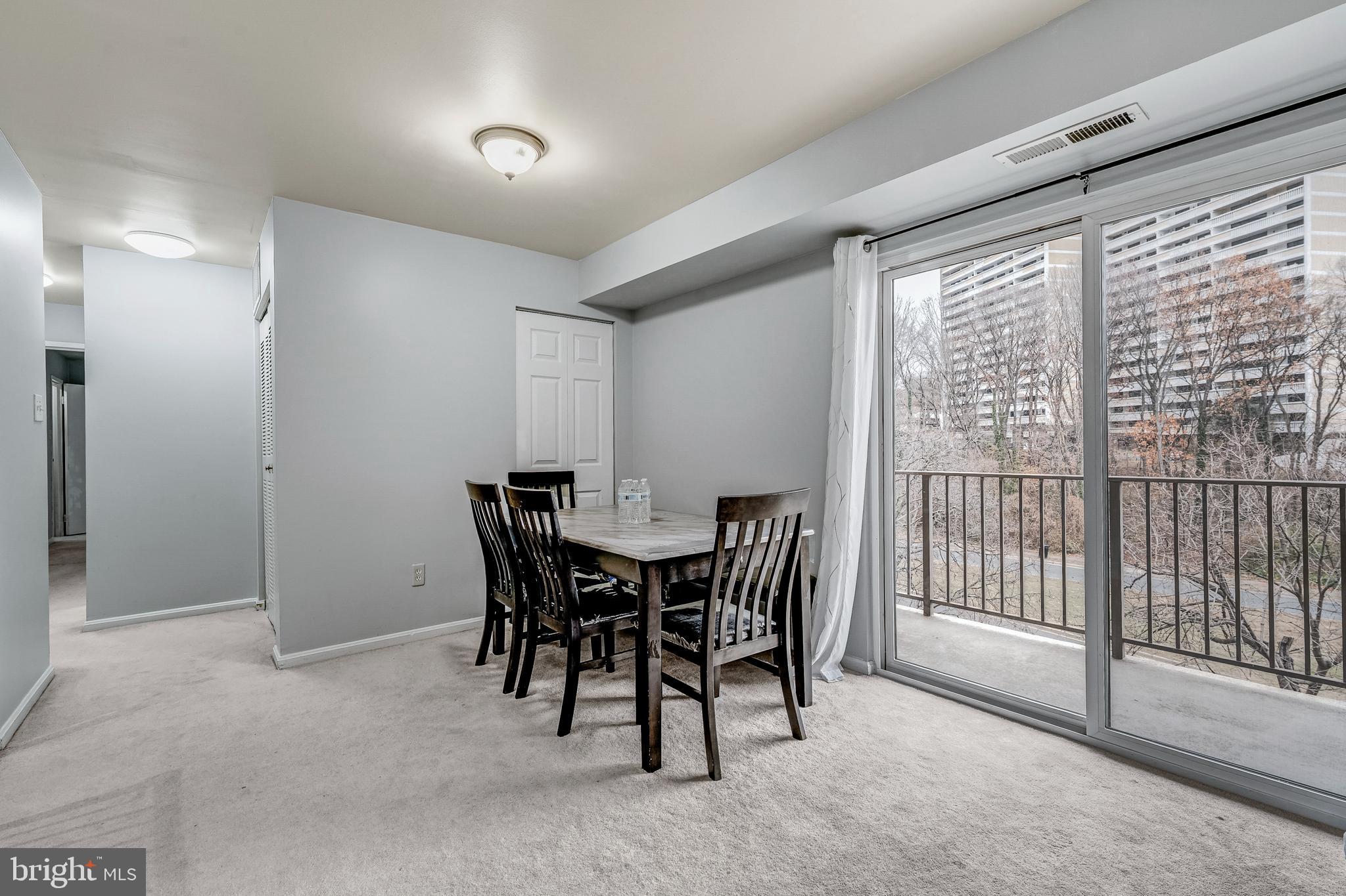 6137 Edsall Road, Unit I Alexandria, VA 22304 - Photo 9 of 28 a view of a dining room with furniture window and outside view