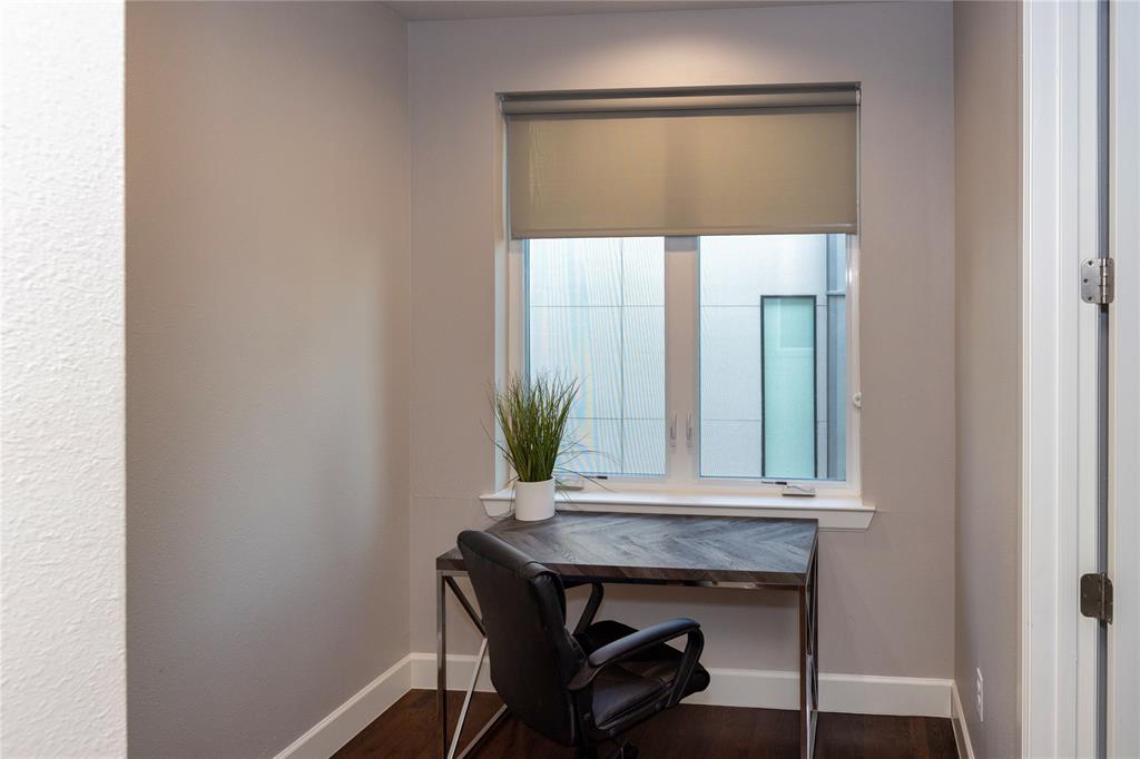 2016 North Fitzhugh Avenue, Unit 101 Dallas, TX 75204 - Photo 12 of 27 a view of a hallway with furniture and a potted plant