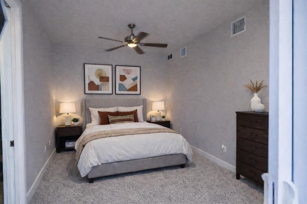 2016 North Fitzhugh Avenue, Unit 101 Dallas, TX 75204 - Photo 13 of 27 a bedroom with a bed and cabinet