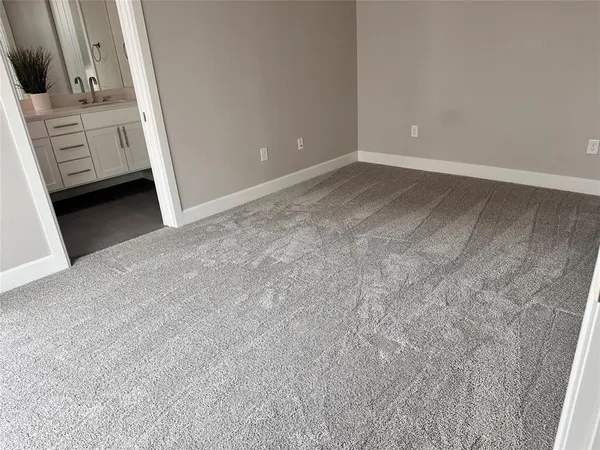 a view of an empty room and fire place