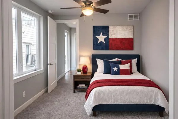 a bedroom with bed and window