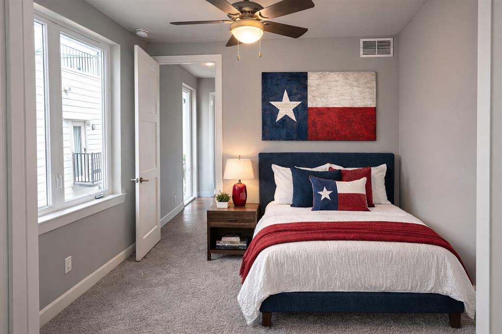 2016 North Fitzhugh Avenue, Unit 101 Dallas, TX 75204 - Photo 17 of 27 a bedroom with bed and window