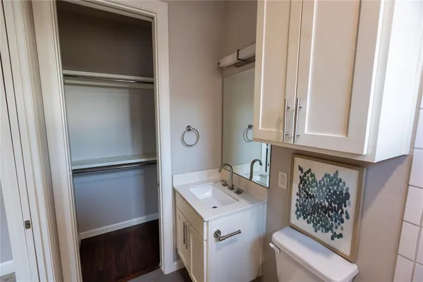 a bathroom with a sink and mirror