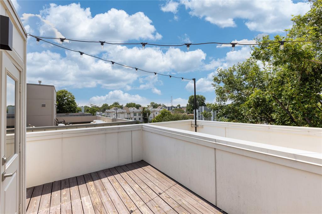 2016 North Fitzhugh Avenue, Unit 101 Dallas, TX 75204 - Photo 23 of 27 a view of a balcony with lots of trees